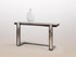 Console, mod&egrave;le �vague� en fer brut et acier bross&eacute;, dessus en fr&ecirc;ne massif fum&eacute;.